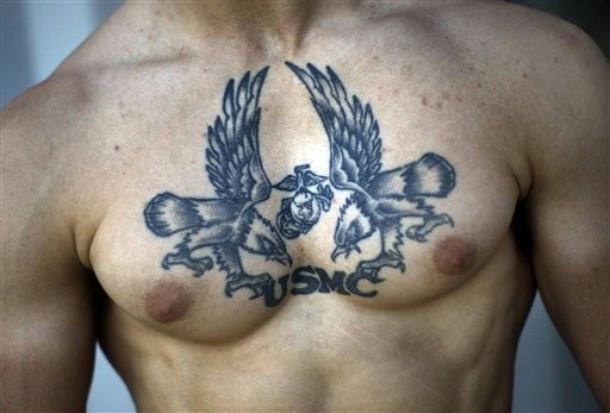  2nd Battalion, 3rd Marines shows of his U.S. Marine Corps tattoo inside 