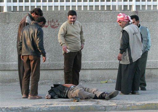 unclaimed dead bodies. unclaimed dead bodies. unclaimed dead bodies. Iraqis inspect the ody of an